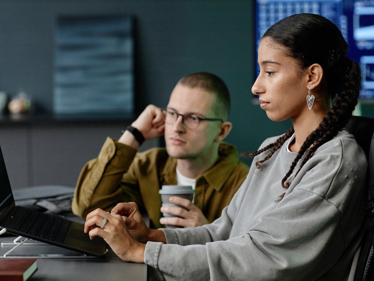 A team working through security training together at their desks