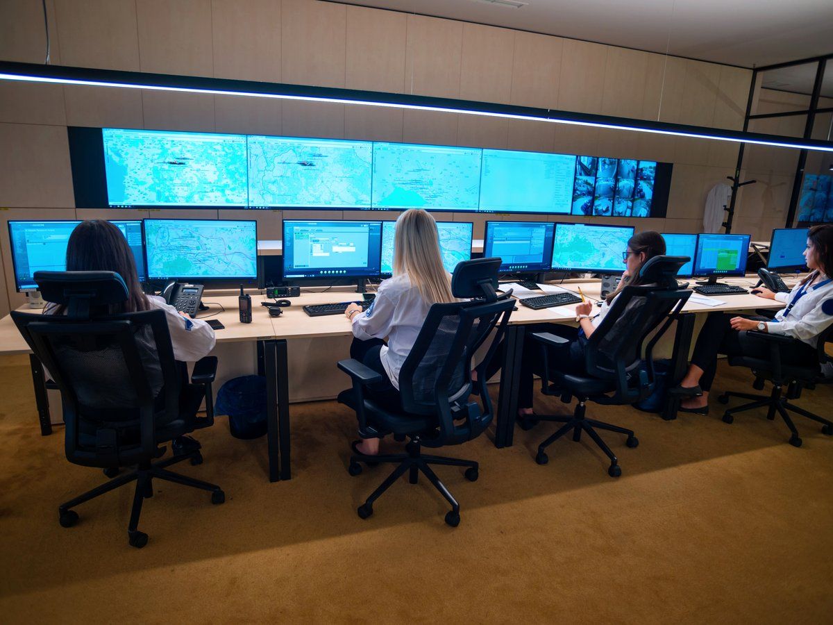 A monitoring team watching systems in a network operations center